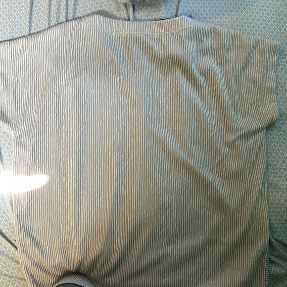 A women’s short sleeve top. Textured with button detail. - Picture 4 of 5